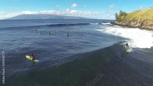 Aerial shot of sufers in Hawaii (2) photo