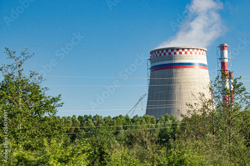 power plant steam cooling tower on blue sky background