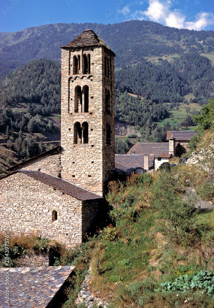 Andorra, Sant Climent de Pal. A stone clock tower indicates the center of a small village.
