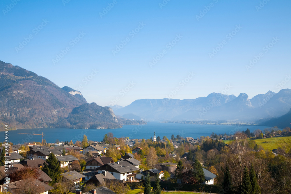 St. Wolfgang, Upper Austria, Austria - High angle view of a residential area near a lake in the valley of a mountain.