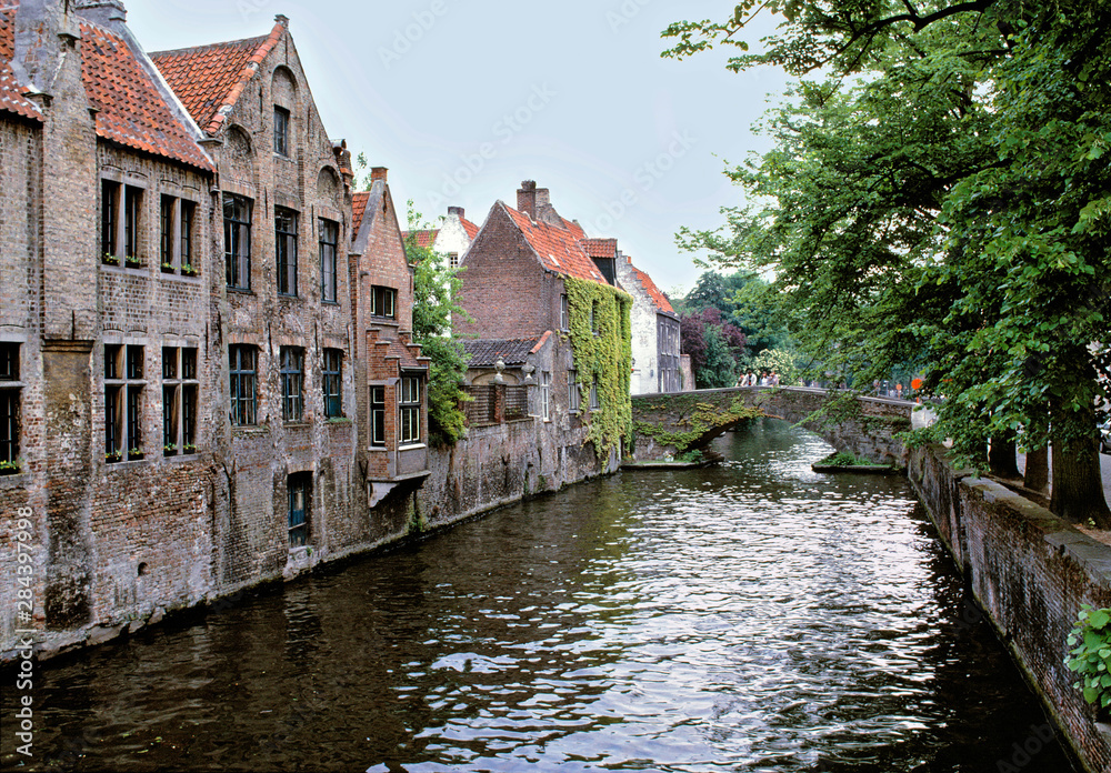Obraz premium Belgium, Brugge. Old stone homes line the canals in Brugge, a World Heritage Site, Belgium.