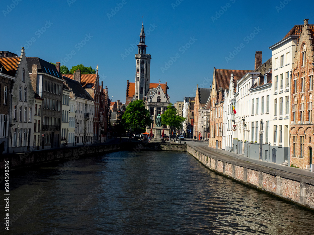 Belgium, Brugge, West Flanders, Canal Scene with homes and Bridge