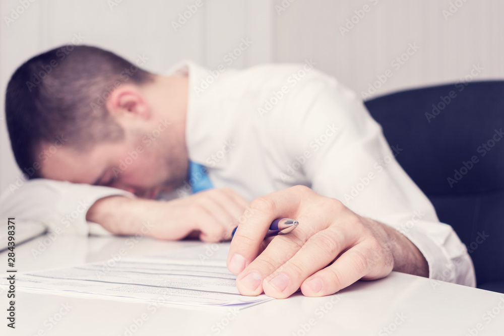 Bussinessman fell asleep at work, close up, toned Bussinessman fell asleep at work, close up, toned