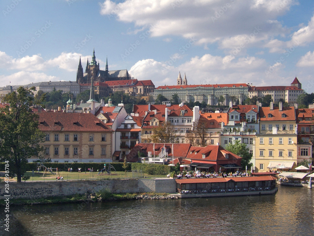Obraz premium Czech Republic, Prague. The view to Prague Castle from the Charles Bridge, Prague, Czech Republic, includes a children's playground.