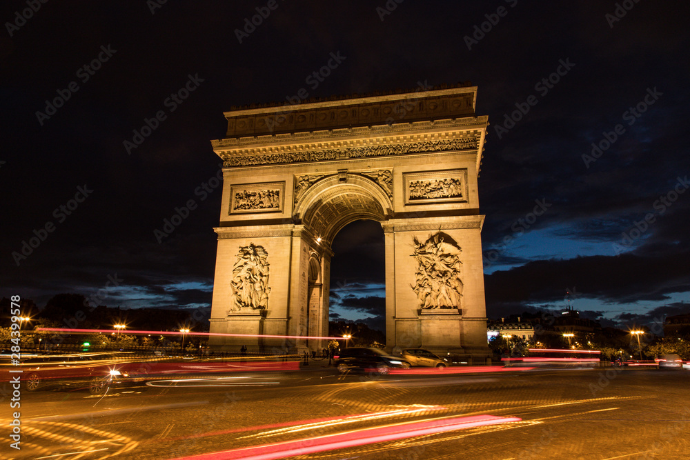 Monument Arc de Triomphe along the Avenue Des Champs-Elysees, Paris, France Monument Arc de Triomphe along the Avenue Des Champs-Elysees, Paris, France