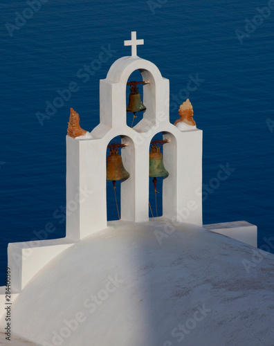 Greece, Santorini. Bell tower and church in neighborhood of Imerovigli.