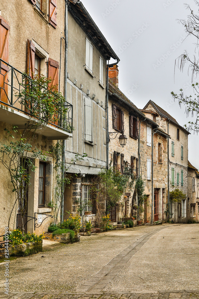 France, Cajarc. Street of homes in the city