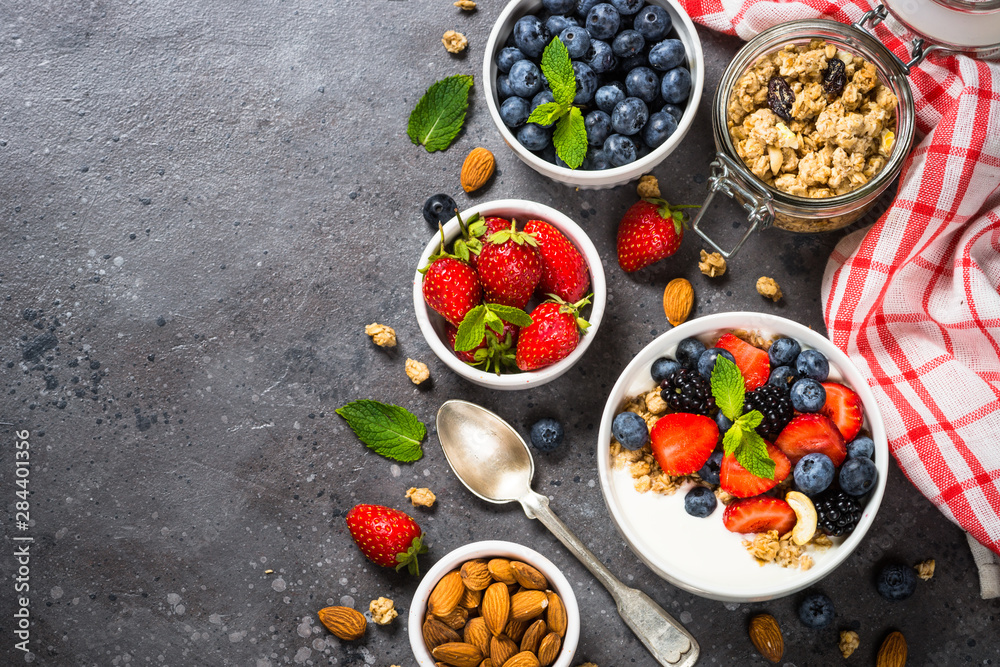 Greek yogurt granola with fresh berries . Greek yogurt granola with fresh berries .