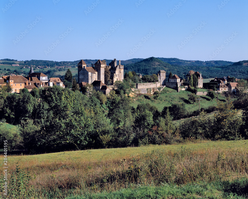 France, Curemonte. The town of Curemonte glistens in the afternoon sun in the Limousin Region of France.