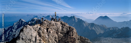 Germany, Bavaria, Zugspitze. Hikers enjoy an inspiring view to the Tirol from the Zugspitze summit in Bavaria, Germany. photo