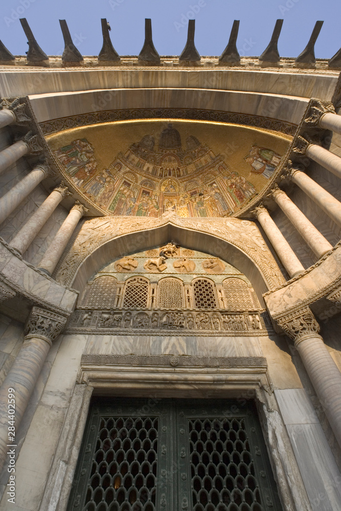 Italy, Venice, St. Mark's Basilica. Door with gilded arch.