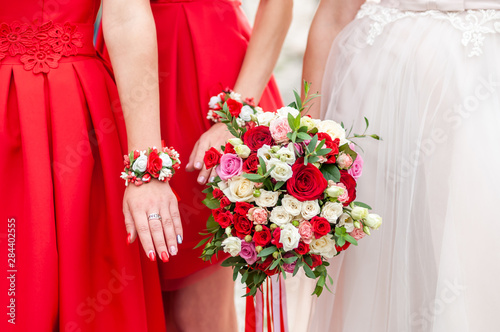 Bouquets of flowers in the hands of the bride and bridesmaids