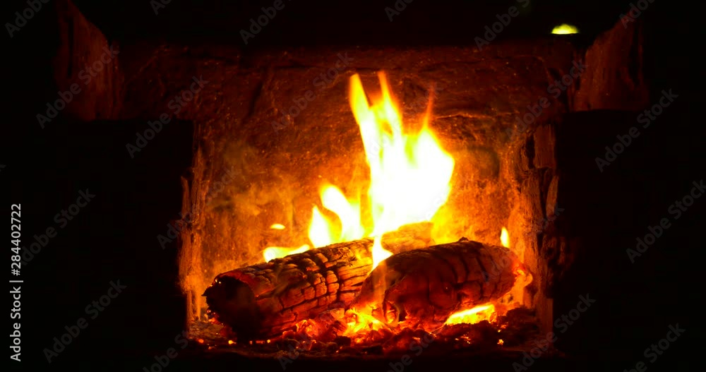 Fireplace with firewood and flame. 4096x2160 Native UHD 30 sec. 24 fps footage of 4K Burning logs in the fireplace Fireplace with firewood and flame. 4096x2160 Native UHD 30 sec. 24 fps footage of 4K Burning logs in the fireplace