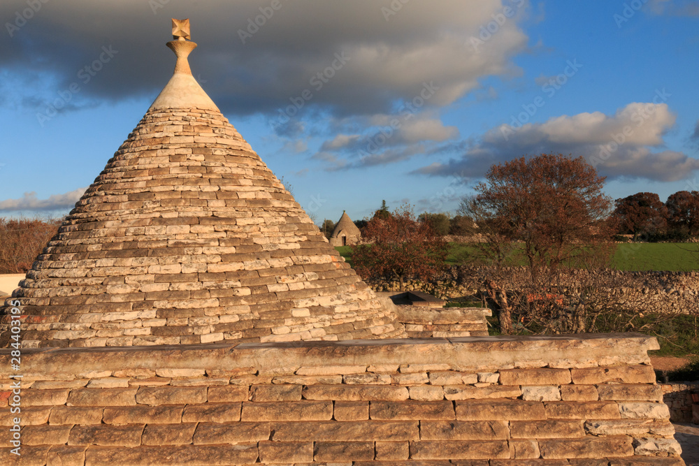 Italy, Apulia, Bari, Itria Valley, Alberobello. A trullo house is a Apulian dry stone hut with a conical roof. UNESCO Heritage Site.