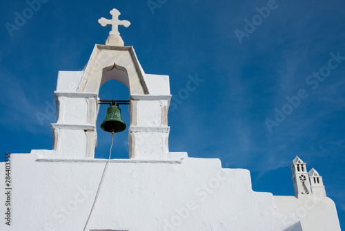 Greece, Cyclades, Mykonos, Hora. Typical whitewashed church rooftop with bell (circa 1811) tower showing traditional Cycladic architecture..