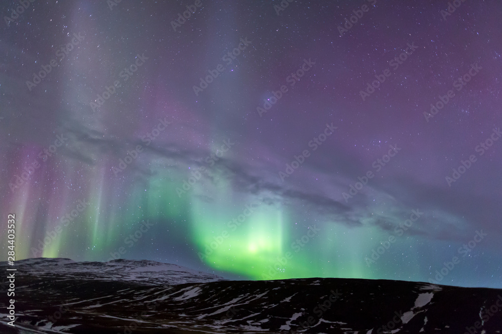 North Iceland, Near Akureyri. The northern lights glow in unbelievable colors.