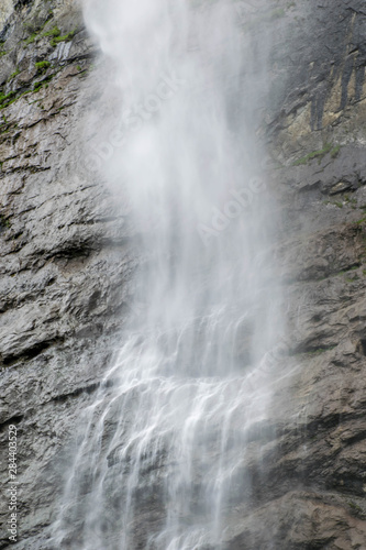 High waterfall falling from the cliff