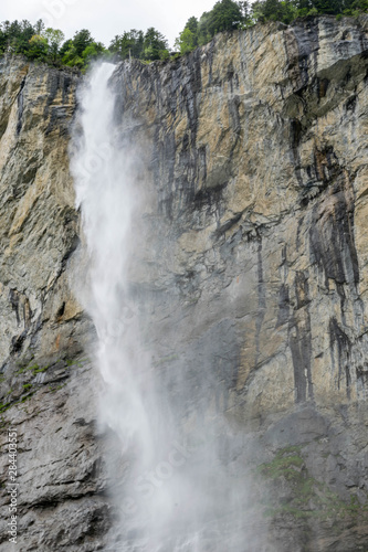 High waterfall (Staubbach) falling from the tall cliff, Lauterbrunnen Switzerland © Anastasija