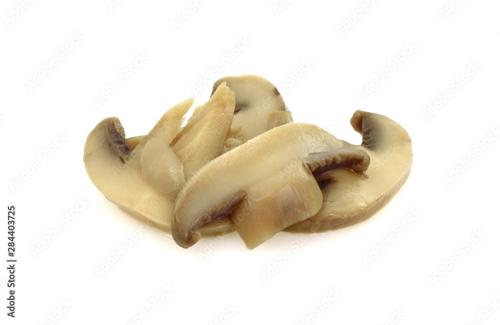 canned mushroom pieces on a white background. canned mushroom pieces on a white background.