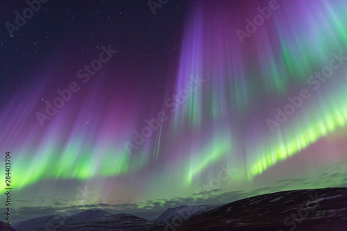 North Iceland, Near Akureyri. The northern lights glow in unbelievable colors.