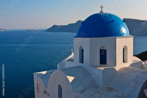 Church on the coast of Aegean Sea. Oia, Santorini Island, Greece.