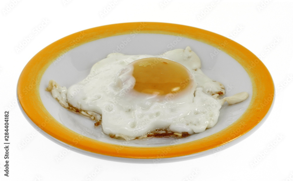 Fried egg on a plate isolated on white background. Fried egg on a plate isolated on white background.
