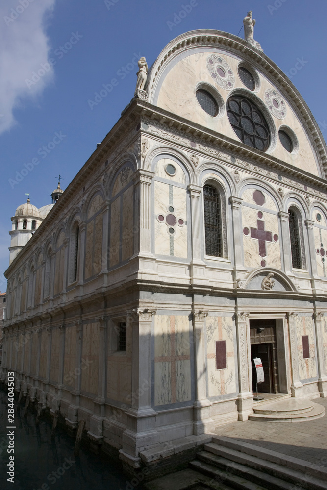 Italy, Venice. Church of Santa Maria dei Miracoli beside canal.