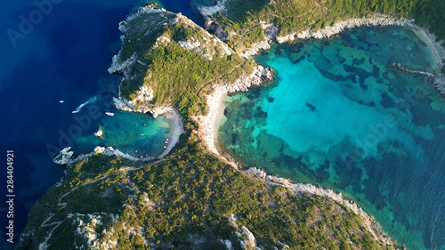 Aerial drone photo of iconic paradise bay of Porto Timoni with tropical deep blue and turquoise clear sea, Corfu island, Ionian, Greece