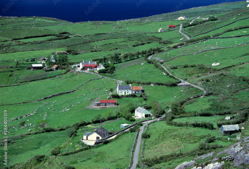 Ireland, Ring of Kerry. Whitewashed homes dot the green landscape of Ring of Kerry, in County Kerry, Ireland. Ireland, Ring of Kerry. Whitewashed homes dot the green landscape of Ring of Kerry, in County Kerry, Ireland.