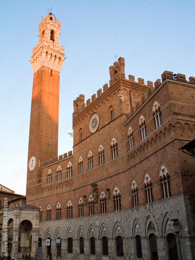 Italy, Tuscany, Sienna. Torre del Mangia at sunset.