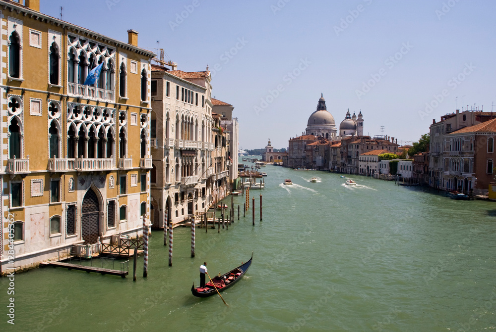 Italy, Venice. A gondola traveling down the Grand Canal.