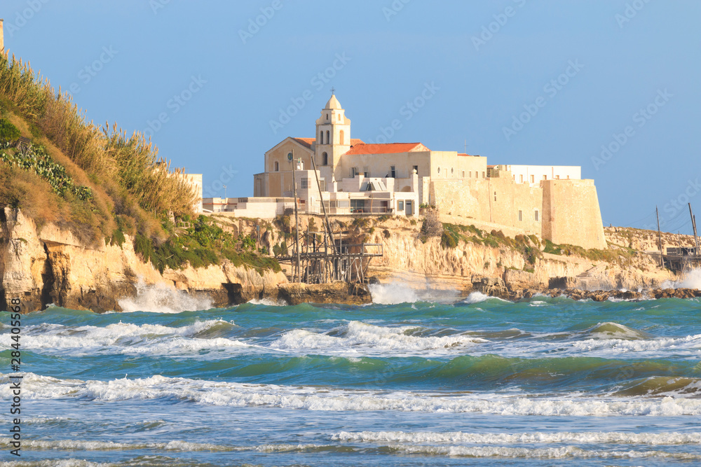 Italy, Foggia, Apulia, Gargano National Park, Vieste. Old town of Vieste cityscape with medieval church at the tip of the peninsula of this fishing village in Gargano. Italy, Foggia, Apulia, Gargano National Park, Vieste. Old town of Vieste cityscape with medieval church at the tip of the peninsula of this fishing village in Gargano.