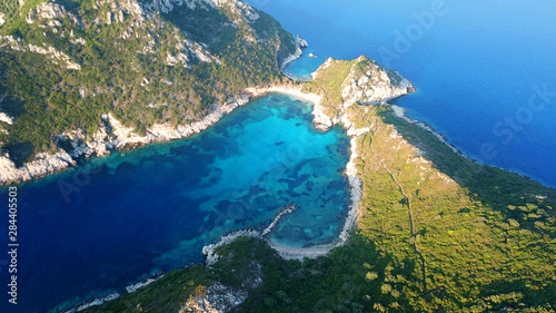 Aerial drone photo of iconic paradise bay of Porto Timoni with tropical deep blue and turquoise clear sea, Corfu island, Ionian, Greece