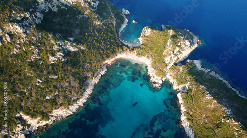Aerial drone photo of iconic paradise bay of Porto Timoni with tropical deep blue and turquoise clear sea, Corfu island, Ionian, Greece