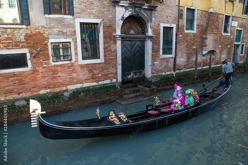 Couple dressed for Gondola ride Venice at Carnival Time, Italy