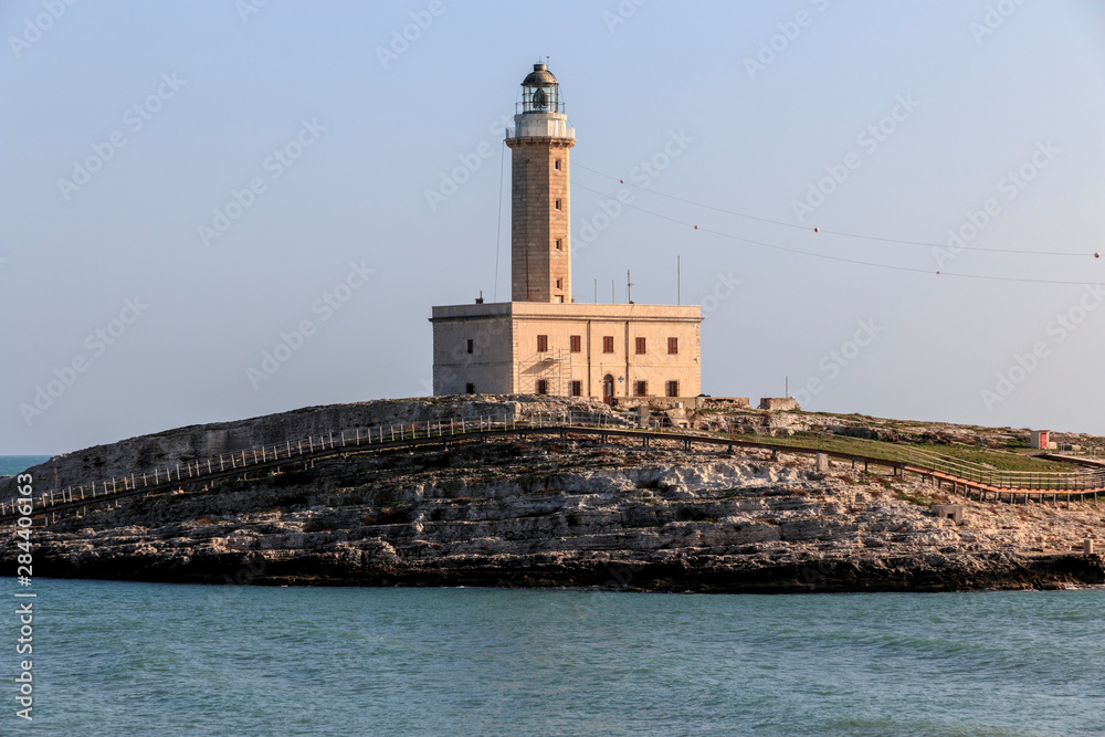 Italy, Foggia, Apulia, Gargano National Park, Vieste. Faro di Isola Santa Eufemia. Lighthouse on the Island of St. Eufemia.