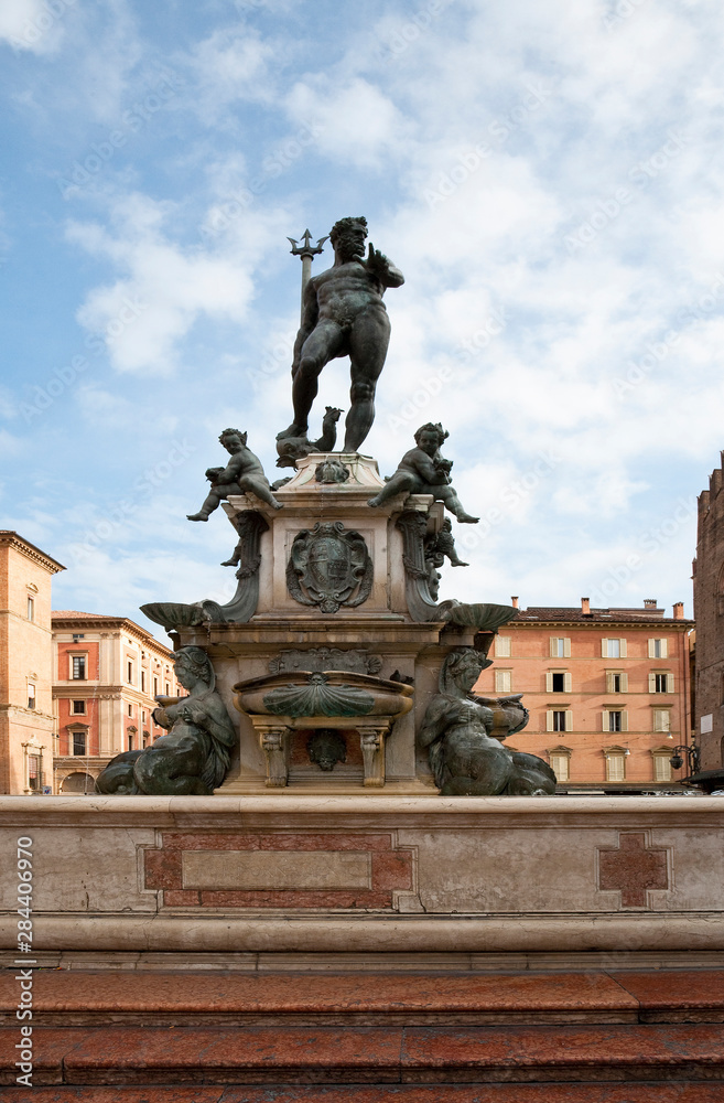 Bologna, Emilia-Romagna, Italy - Stone steps leading to a fountain with a statue of the Roman god Neptune.