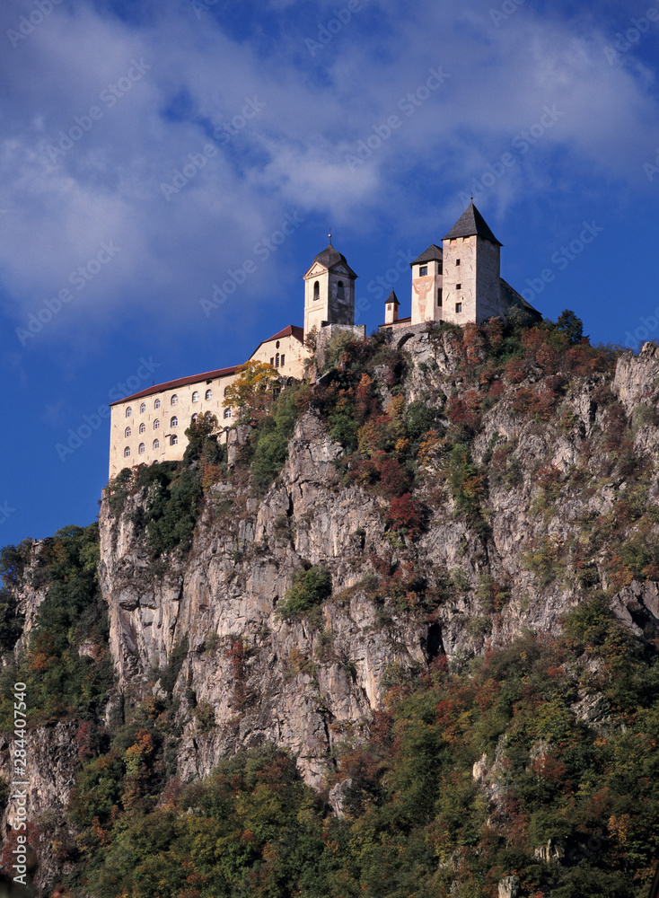 Italy, Chiusa. A summer view of a hill-top monastery, in Chiusa or Klausen, Dolomite Alps, Italy.