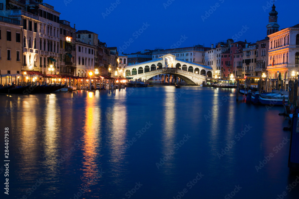 Grand Canal with View of Rialto Bridge with Evening Blue light and Lights.