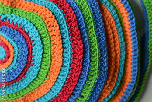 Handmade crocheted abstract pattern of colorful lines