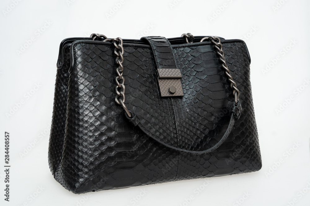 Female handbag made of black leather isolated on a white background. Female handbag made of black leather isolated on a white background.
