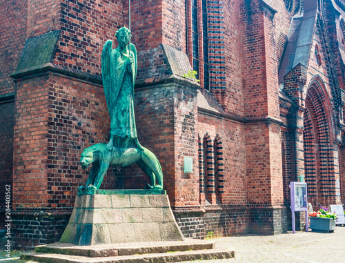 Statue Geistkampfer in front of the church in Kiel, Germany photo