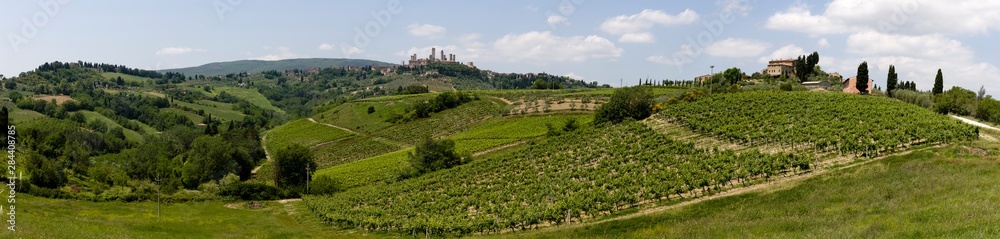 Panorama. Rolling hills landscape. San Gimignano skyline. Tuscany, Italy.