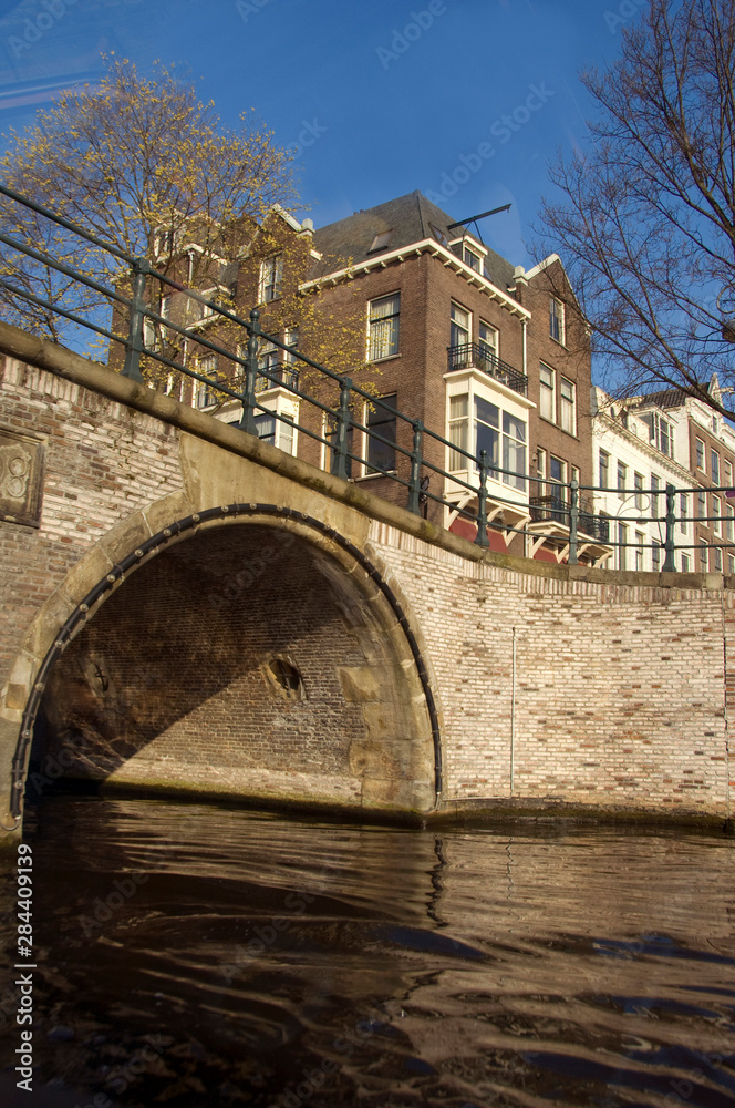 The Netherlands (aka Holland), Amsterdam. Canal bridge.