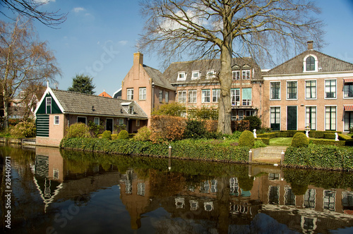 The Netherlands (aka Holland). Medieval cheese producing town of Edam. Typical homes along the canals in Edam.