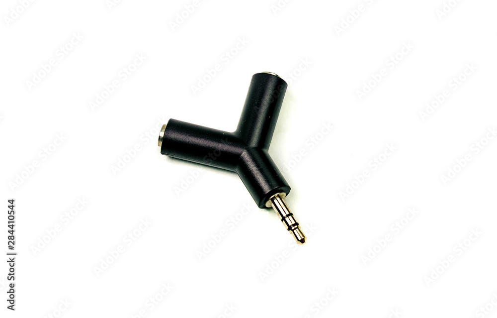 Audio adapter with two microphone and headphone jacks isolated on white background. Audio adapter with two microphone and headphone jacks isolated on white background.