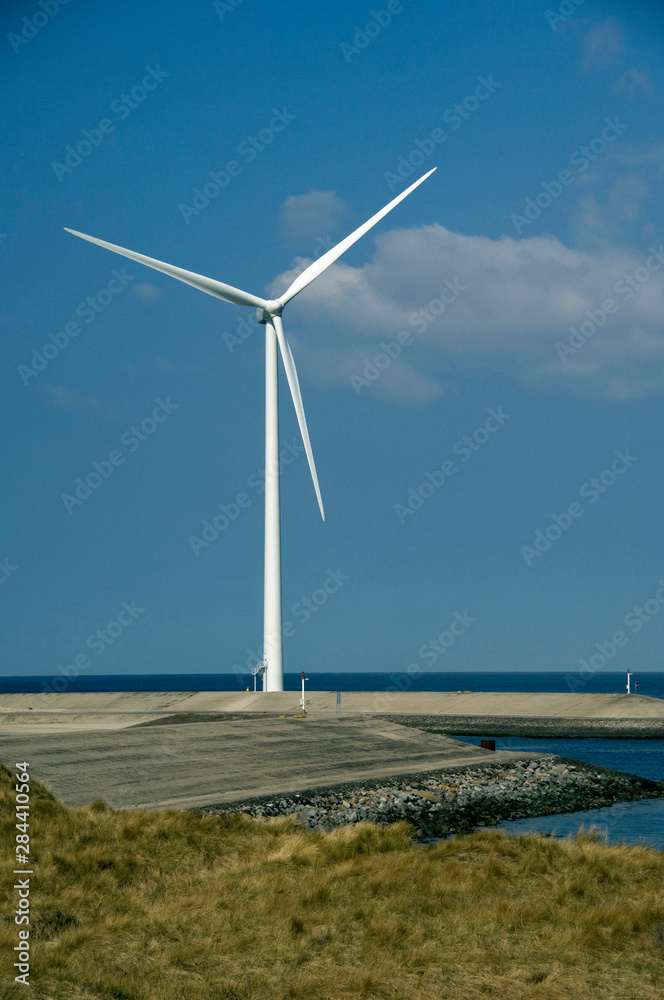 The Netherlands (aka Holland), Zeeland, Oosterscheldekering, Delta Works project. Modern windmill along the North Sea