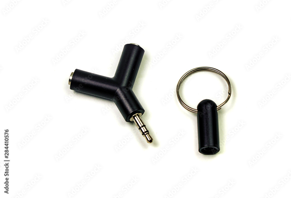 Audio adapter with two microphone and headphone jacks isolated on white background.