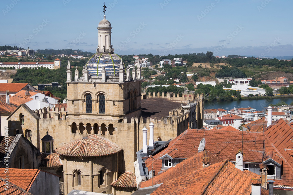 Portugal, Coimbra. Romanesque style tower and dome of the Coimbra Cathedral.
