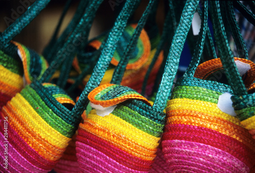 Portugal: Palmela, colorful purses for sale. photo